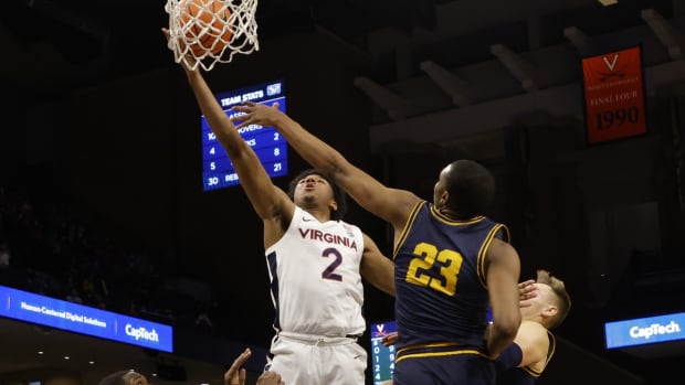Nov 19, 2021; Charlottesville, Virginia, USA; Virginia Cavaliers guard Reece Beekman (2) shoots the ball as Coppin State Eagles forward Tyree Corbett (23) defends during the second half at John Paul Jones Arena. Mandatory Credit: Geoff Burke-USA TODAY Sports